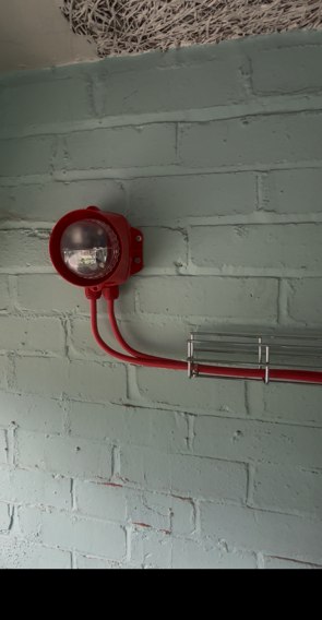 Fire alarm sounder beacon installed on a wall